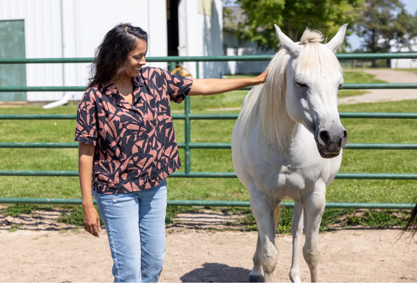 Lauren Enty with one of the horses at MSU Horse Teaching & Research Center.